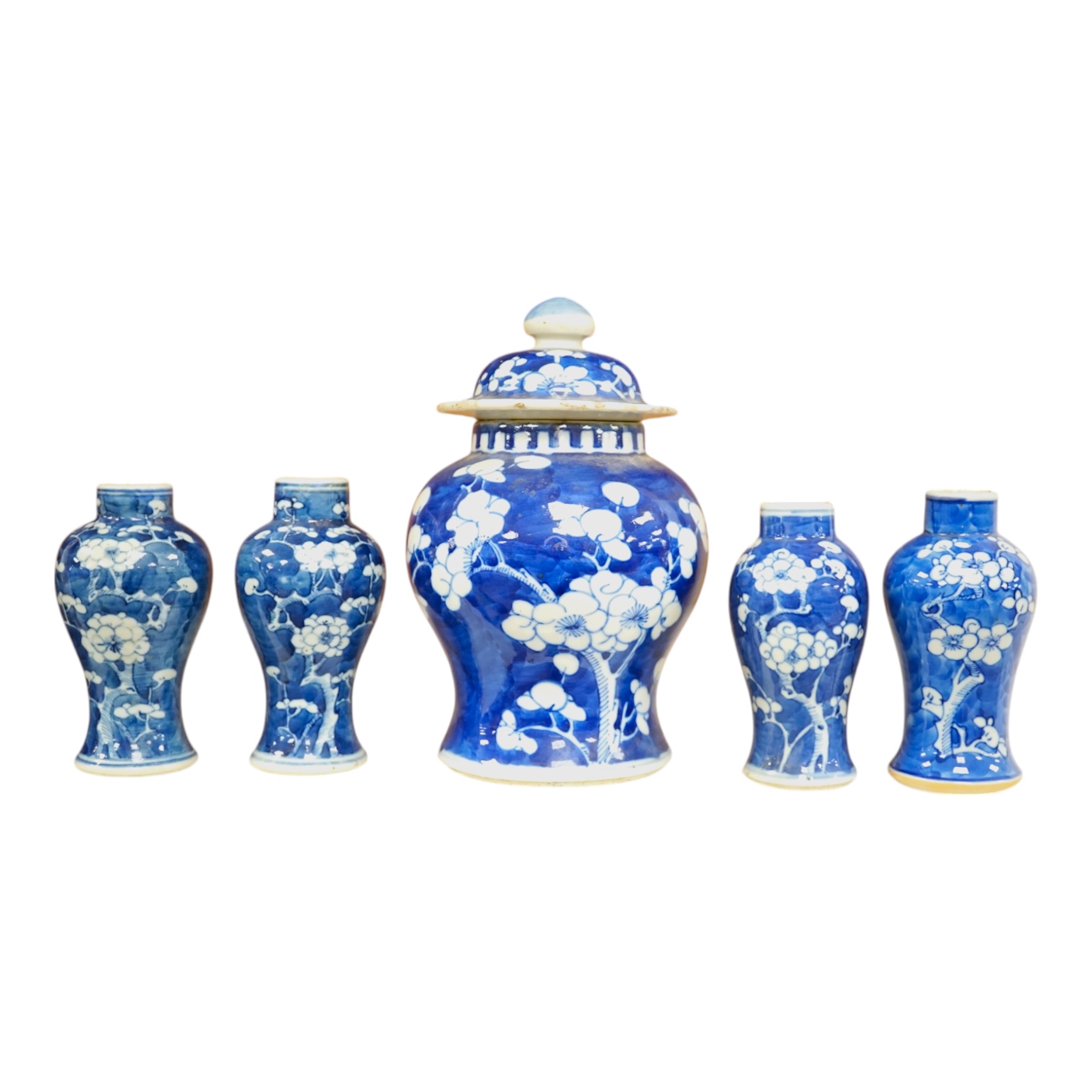 A group of five Chinese blue and white prunus vases, one with cover, late 19th century, tallest 20cm. Condition - varies